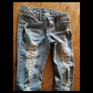 Distressed denim jeans